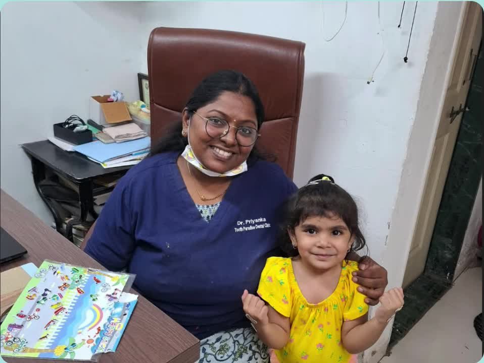 Dr. Priyanka Murde with a young patient at Tooth Paradise